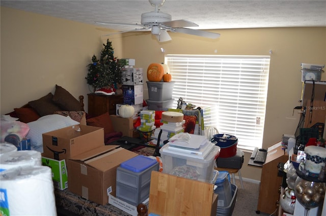 interior space with ceiling fan