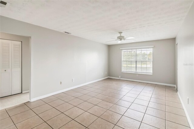 5413 Hansel Ave Unit K10, Orlando, FL 32809 - spare room featuring light tile patterned floors and ceiling fan