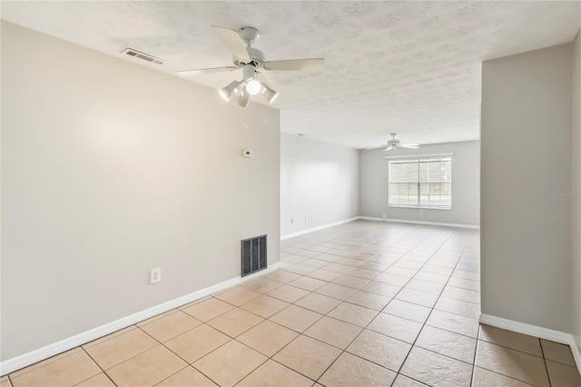 5413 Hansel Ave Unit K10, Orlando, FL 32809 - empty room featuring ceiling fan, light tile patterned flooring, and a textured ceiling