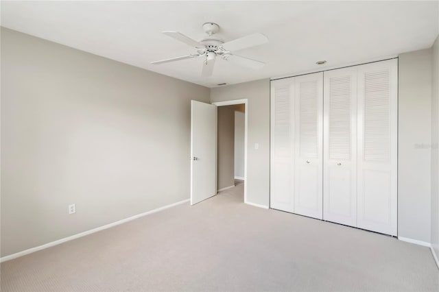 5413 Hansel Ave Unit K10, Orlando, FL 32809 - unfurnished bedroom featuring light colored carpet, a closet, and a ceiling fan