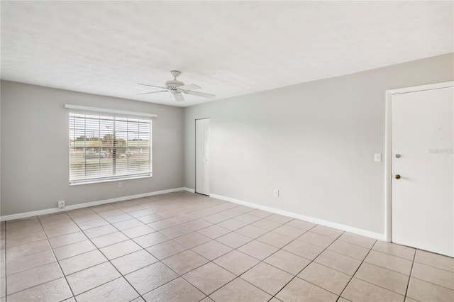 5413 Hansel Ave Unit K10, Orlando, FL 32809 - empty room featuring ceiling fan and light tile patterned floors