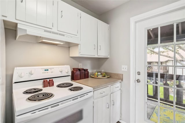 5413 Hansel Ave Unit K10, Orlando, FL 32809 - kitchen featuring white electric stove, under cabinet range hood, light countertops, and white cabinets