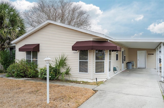 view of front of home featuring a carport