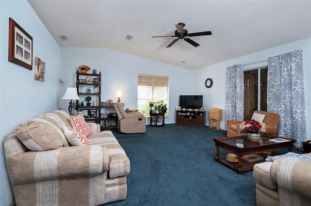 living room featuring ceiling fan, carpet floors, a textured ceiling, and vaulted ceiling