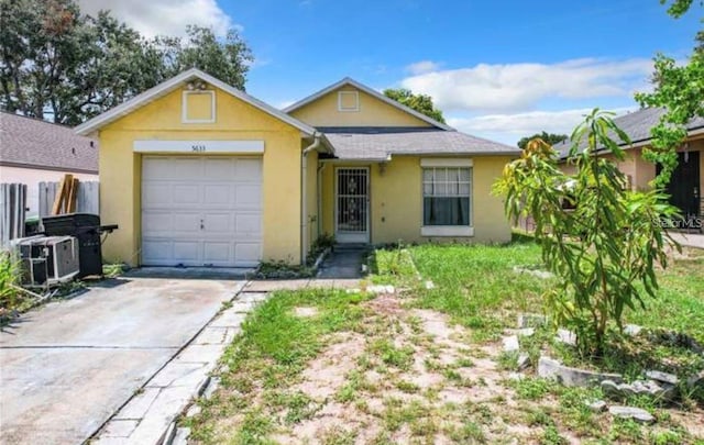 single story home featuring a garage