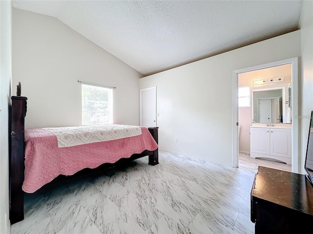 5633 Piney Ridge Dr, Orlando, FL 32808 - bedroom featuring ensuite bath, vaulted ceiling, and a textured ceiling