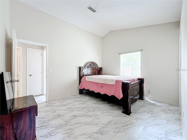 5633 Piney Ridge Dr, Orlando, FL 32808 - bedroom with vaulted ceiling and a textured ceiling