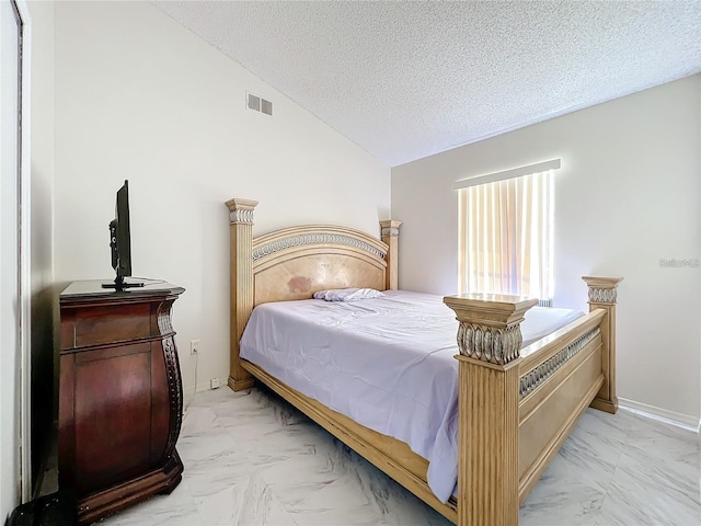 5633 Piney Ridge Dr, Orlando, FL 32808 - bedroom featuring vaulted ceiling and a textured ceiling