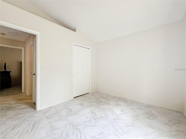 5633 Piney Ridge Dr, Orlando, FL 32808 - unfurnished bedroom featuring lofted ceiling and a closet