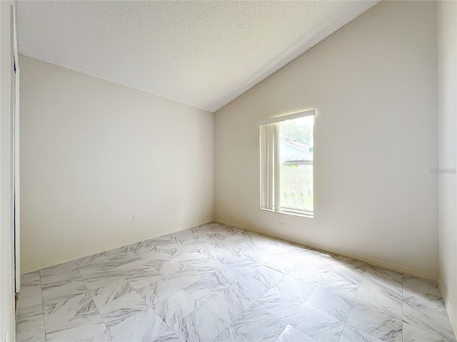 5633 Piney Ridge Dr, Orlando, FL 32808 - unfurnished room featuring lofted ceiling and a textured ceiling