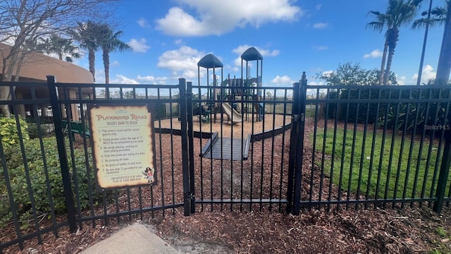 view of gate featuring fence