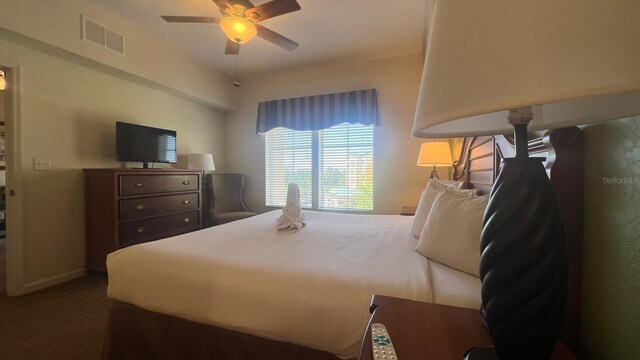8112 Poinciana Blvd, Orlando, FL 32821 - carpeted bedroom with a ceiling fan and visible vents