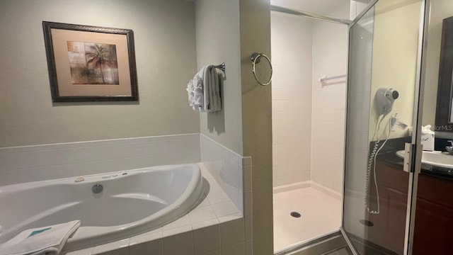 8112 Poinciana Blvd, Orlando, FL 32821 - full bathroom featuring a shower stall, a bath, and vanity