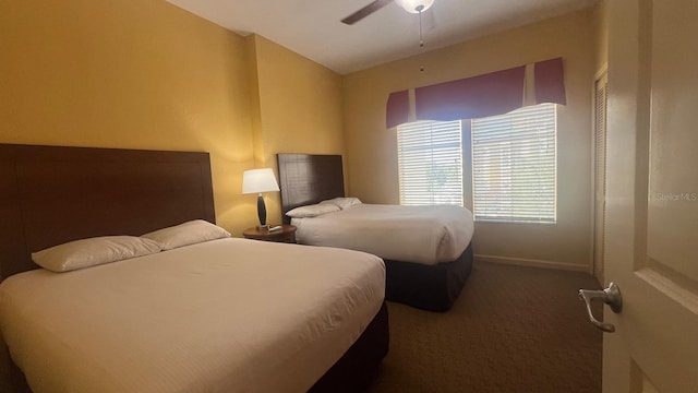 8112 Poinciana Blvd, Orlando, FL 32821 - carpeted bedroom featuring baseboards and ceiling fan