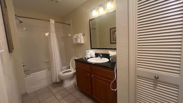 8112 Poinciana Blvd, Orlando, FL 32821 - bathroom featuring visible vents, toilet, shower / bath combination with curtain, tile patterned floors, and vanity