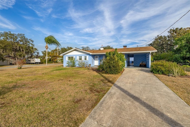 single story home featuring a carport and a front yard