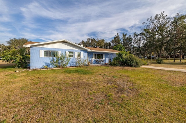 ranch-style house with a front yard