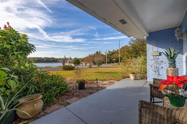 view of patio / terrace featuring a water view