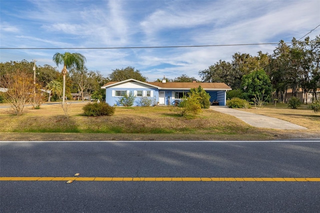 ranch-style home with a front yard