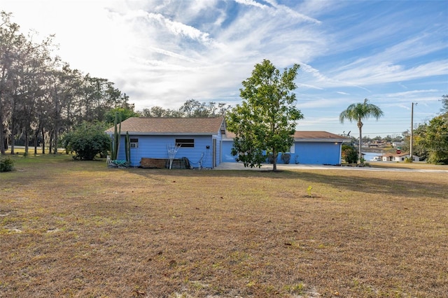 ranch-style home with a front lawn