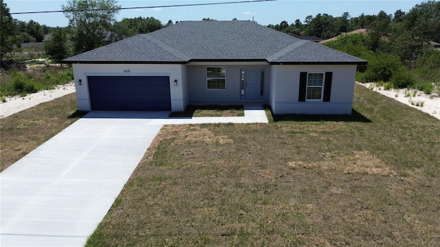 view of front facade with an attached garage, driveway, roof with shingles, a front lawn, and stucco siding
