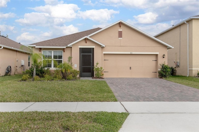 ranch-style house with decorative driveway, stucco siding, a shingled roof, a garage, and a front lawn