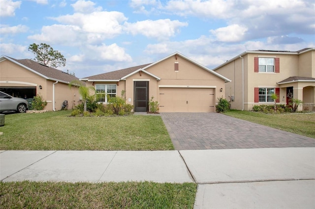 view of front facade with a front lawn, decorative driveway, an attached garage, and stucco siding