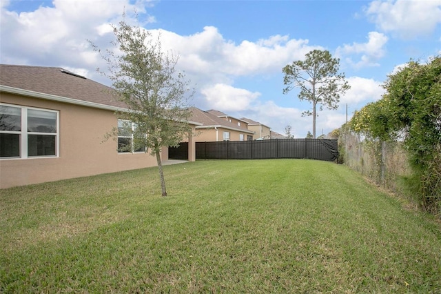 view of yard with a fenced backyard