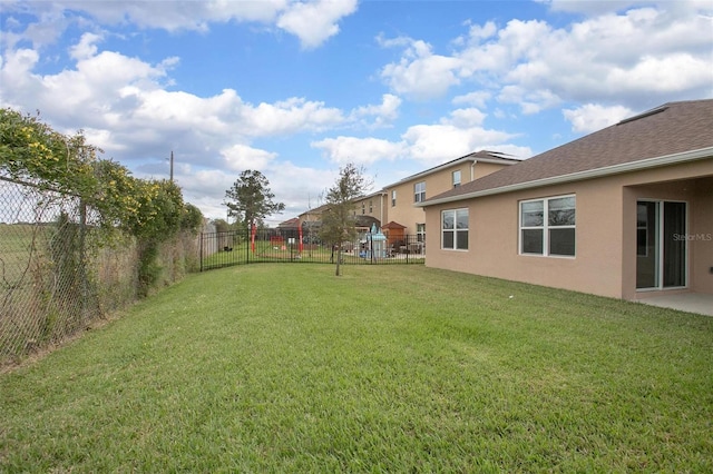 view of yard with a fenced backyard