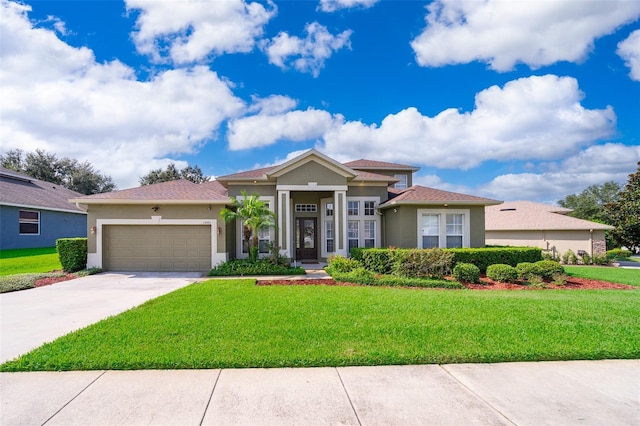 view of front of house with a garage and a front yard