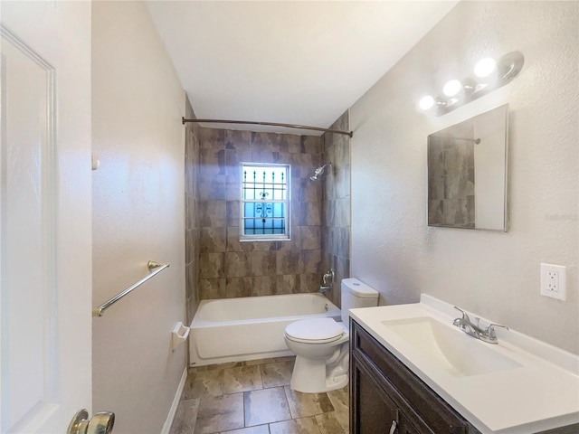 full bathroom featuring vanity, toilet, and tiled shower / bath combo