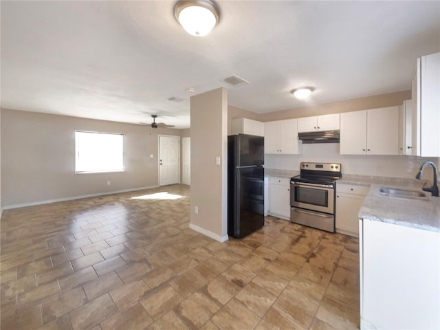 kitchen featuring black refrigerator, stainless steel electric range oven, sink, and white cabinets