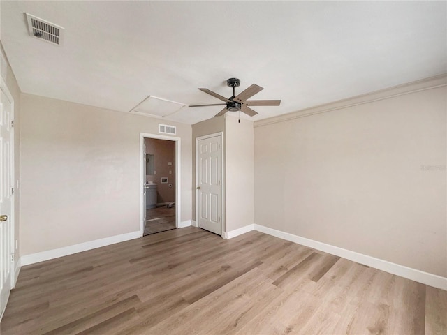 empty room with ceiling fan and wood-type flooring