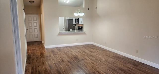 interior space with dark hardwood / wood-style floors and sink