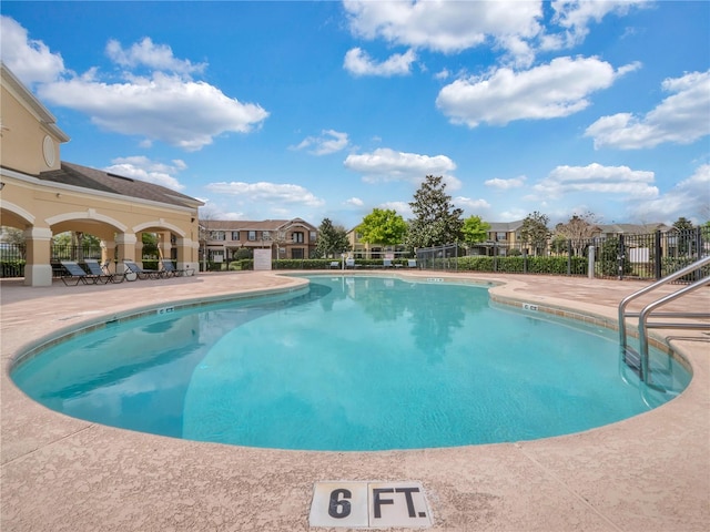 view of swimming pool featuring a patio area