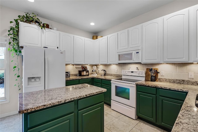 kitchen featuring white cabinetry, white appliances, tasteful backsplash, and green cabinetry