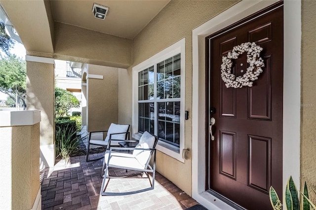 entrance to property with covered porch