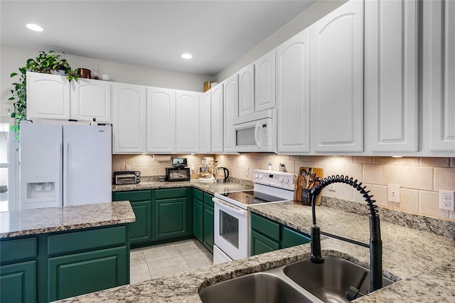 kitchen featuring white cabinetry, sink, white appliances, and light stone counters