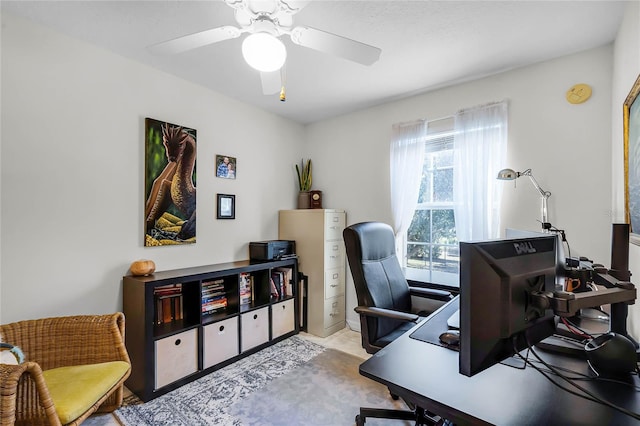 tiled home office featuring ceiling fan