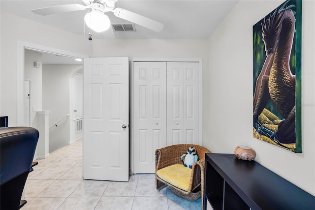 office space featuring light tile patterned floors and ceiling fan