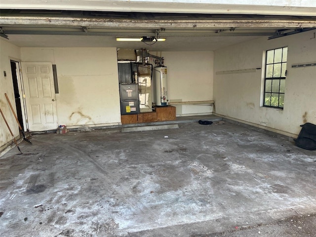 garage with heating unit and gas water heater