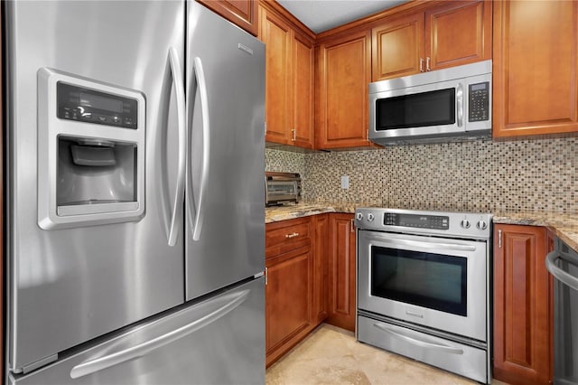 kitchen with tasteful backsplash, light stone countertops, light tile patterned floors, and stainless steel appliances