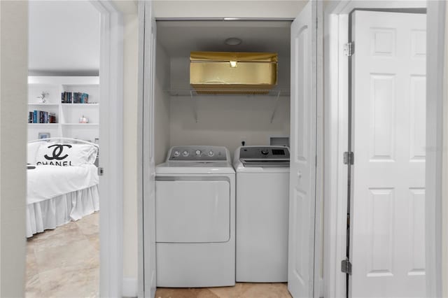 laundry room with washer and clothes dryer