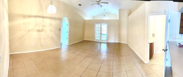 unfurnished room featuring light tile patterned flooring, ceiling fan, and lofted ceiling