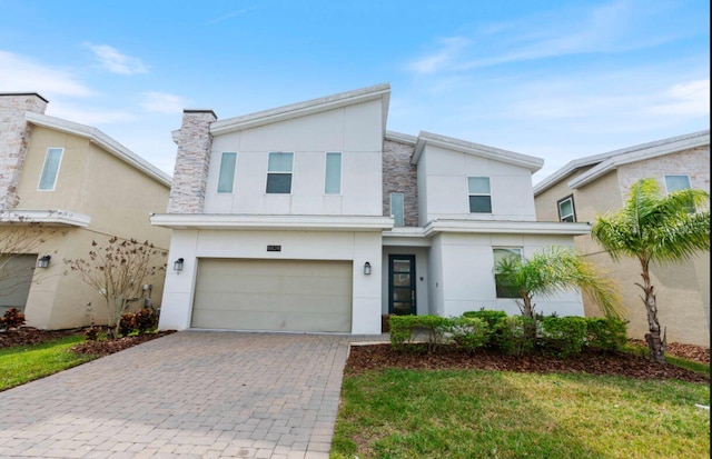 view of front of property with a garage and a front yard