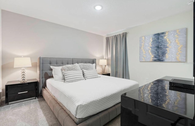 bedroom with light colored carpet