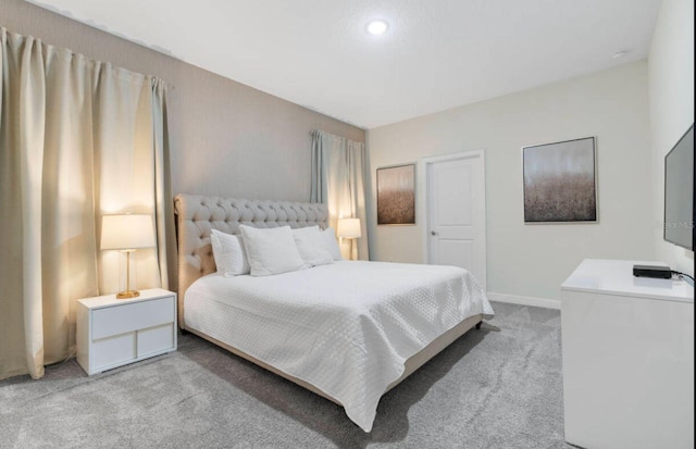 bedroom with light colored carpet