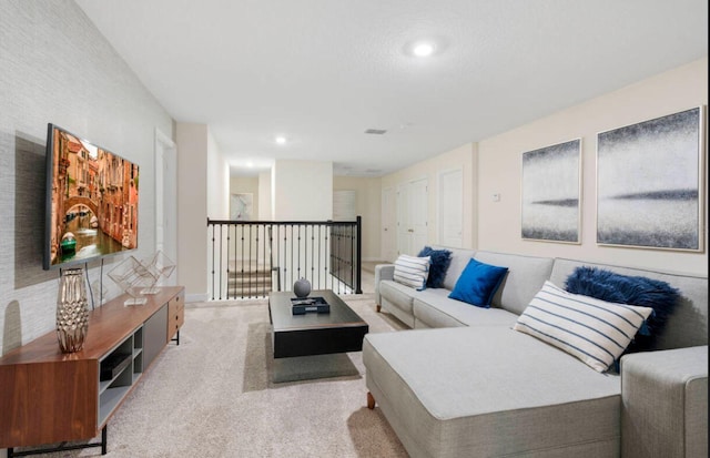 living room with light colored carpet