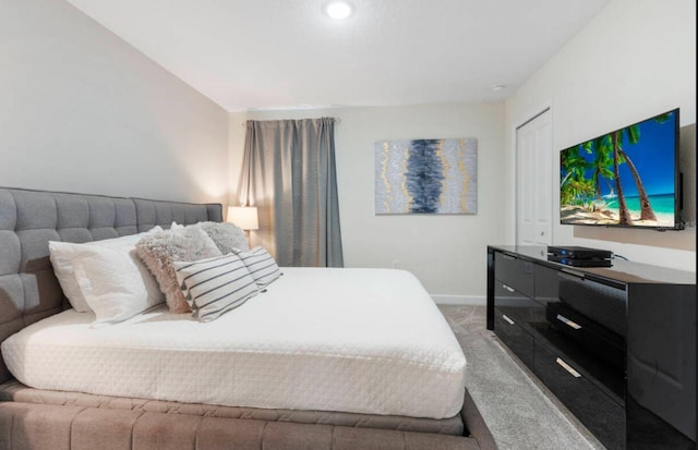 carpeted bedroom featuring a closet