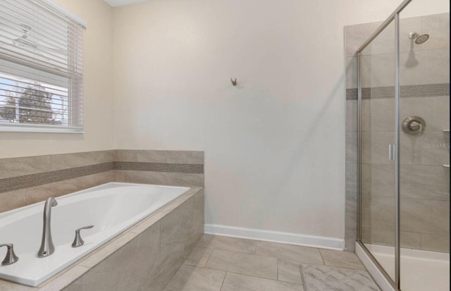 bathroom featuring shower with separate bathtub and tile patterned flooring